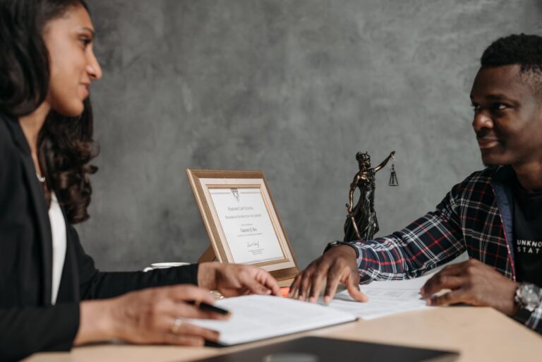 Attorney reviewing documents with a client before notarization